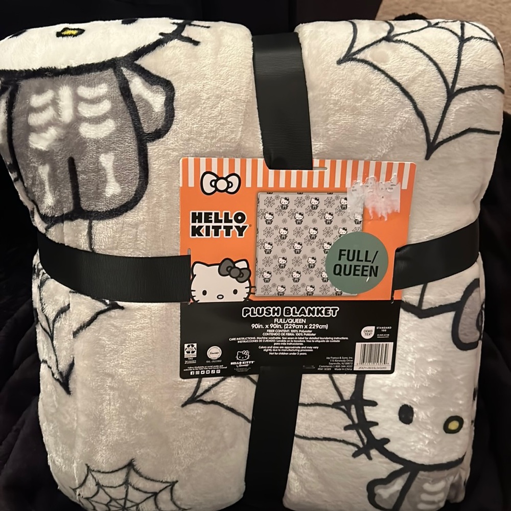Hello Kitty plush blanket, cobwebs and skeletons, NWT
